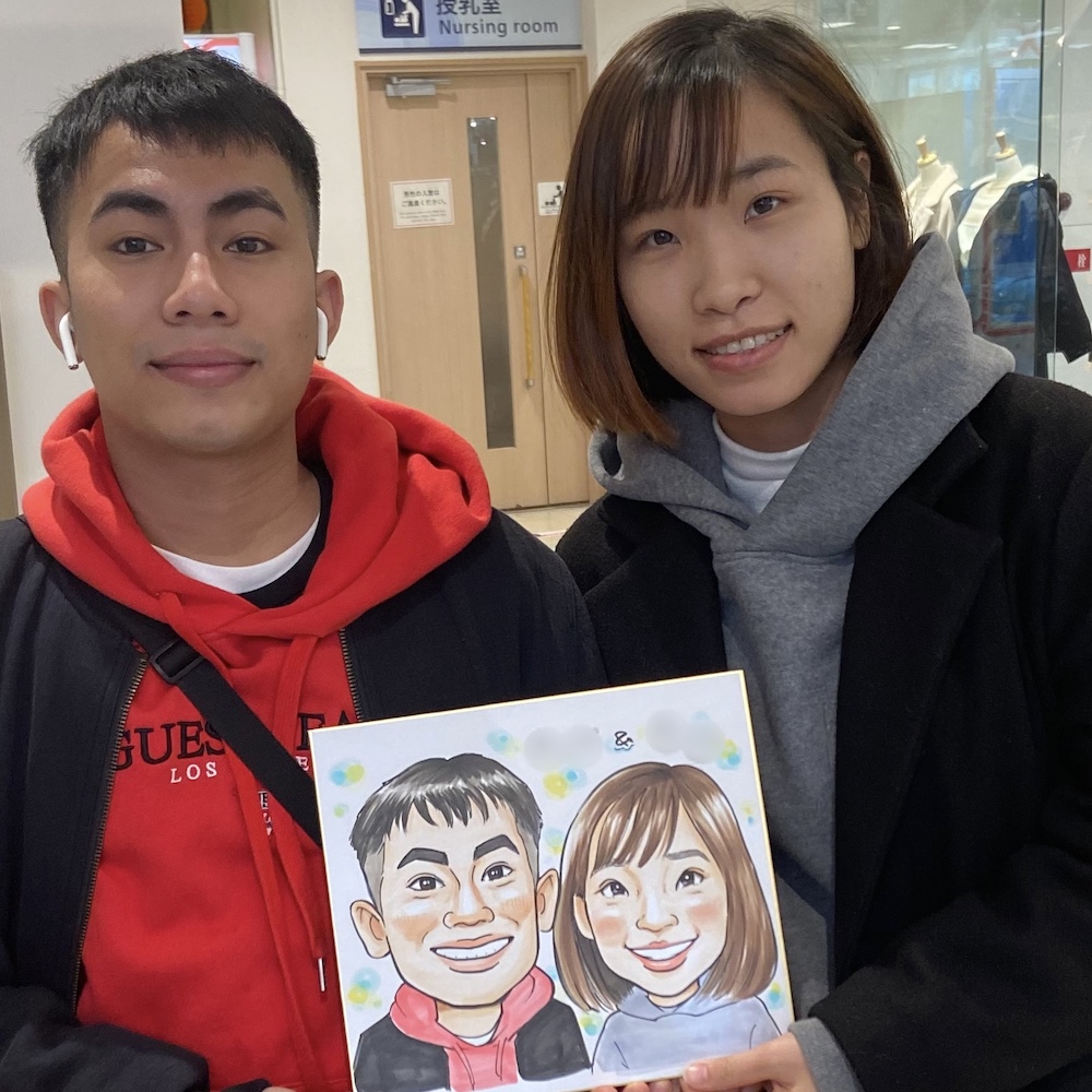 大阪旅行にきたカップルの似顔絵